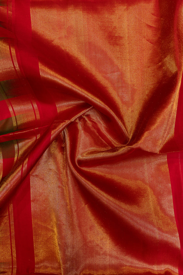 Close-up of red and orange fabric with a subtle pattern