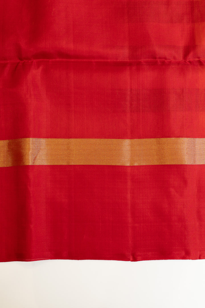 Red fabric with a subtle pattern on a white background