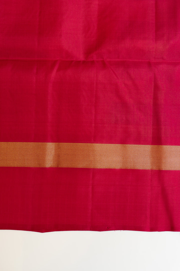 Close-up of a pink fabric with a brown border on a white background