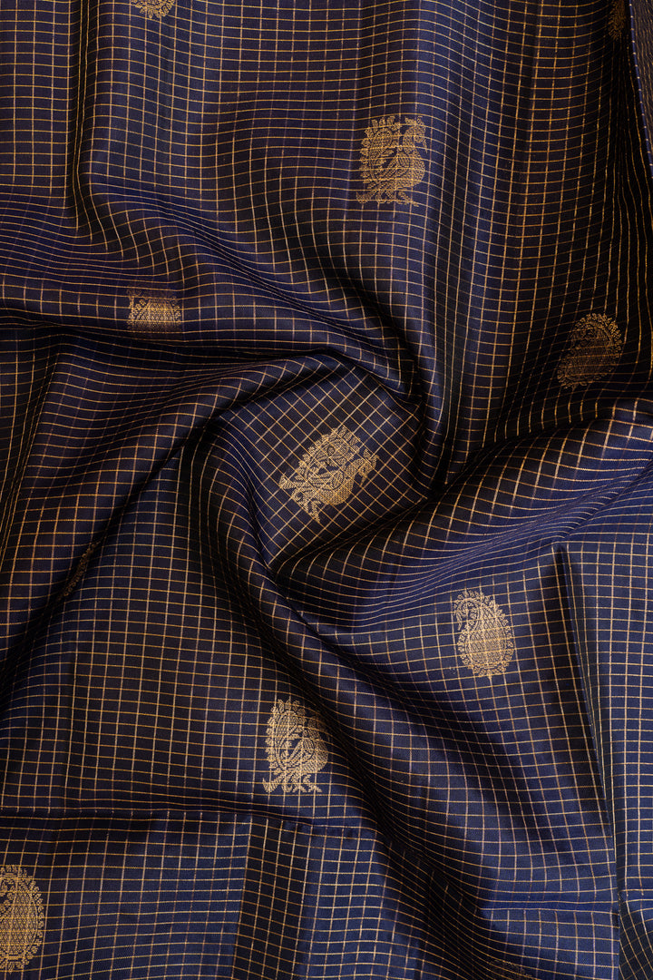 Close-up of blue fabric with gold patterns