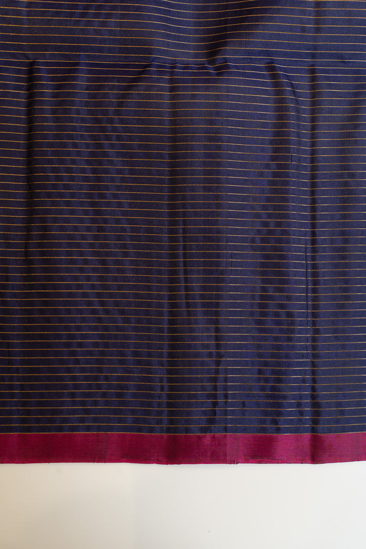 Navy fabric with thin red stripe on a white background