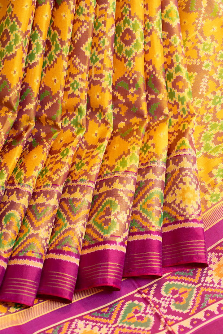 Yellow and pink pure patola ikat silk saree