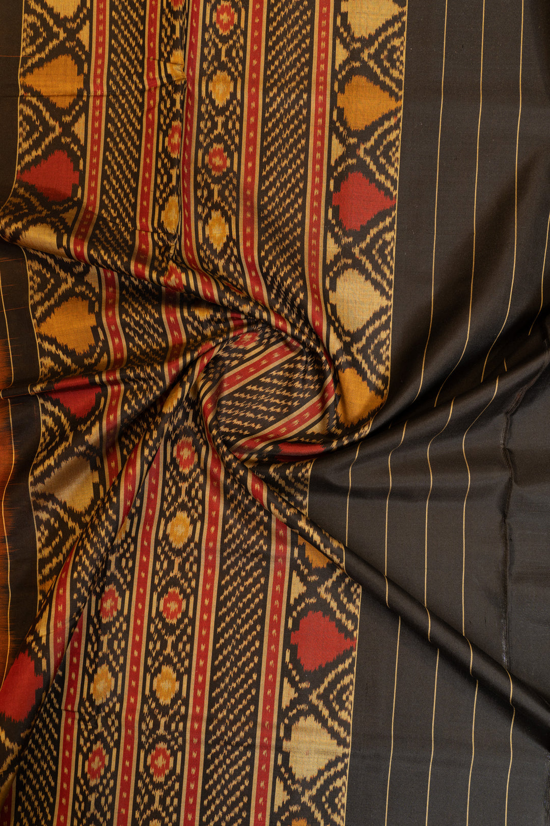 Rust orange and black pure patola ikat silk saree