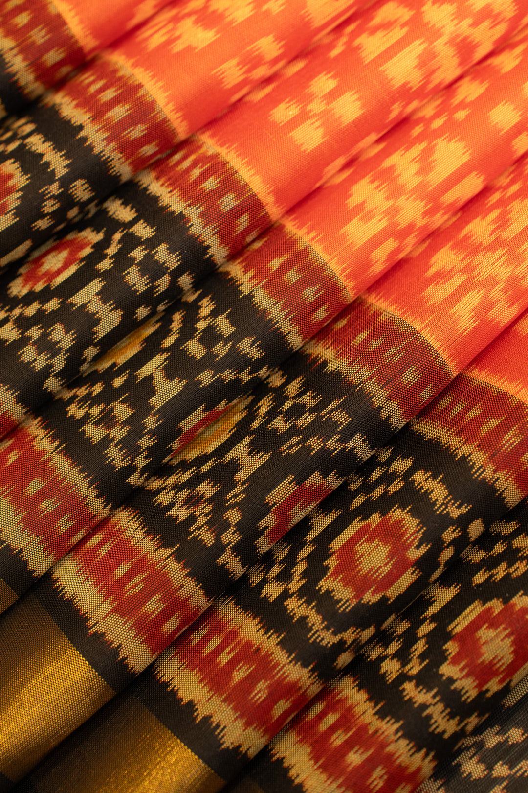 Rust orange and black pure patola ikat silk saree