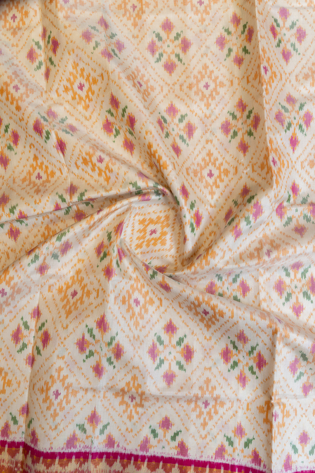 Off white and pink pure Patola ikat silk saree