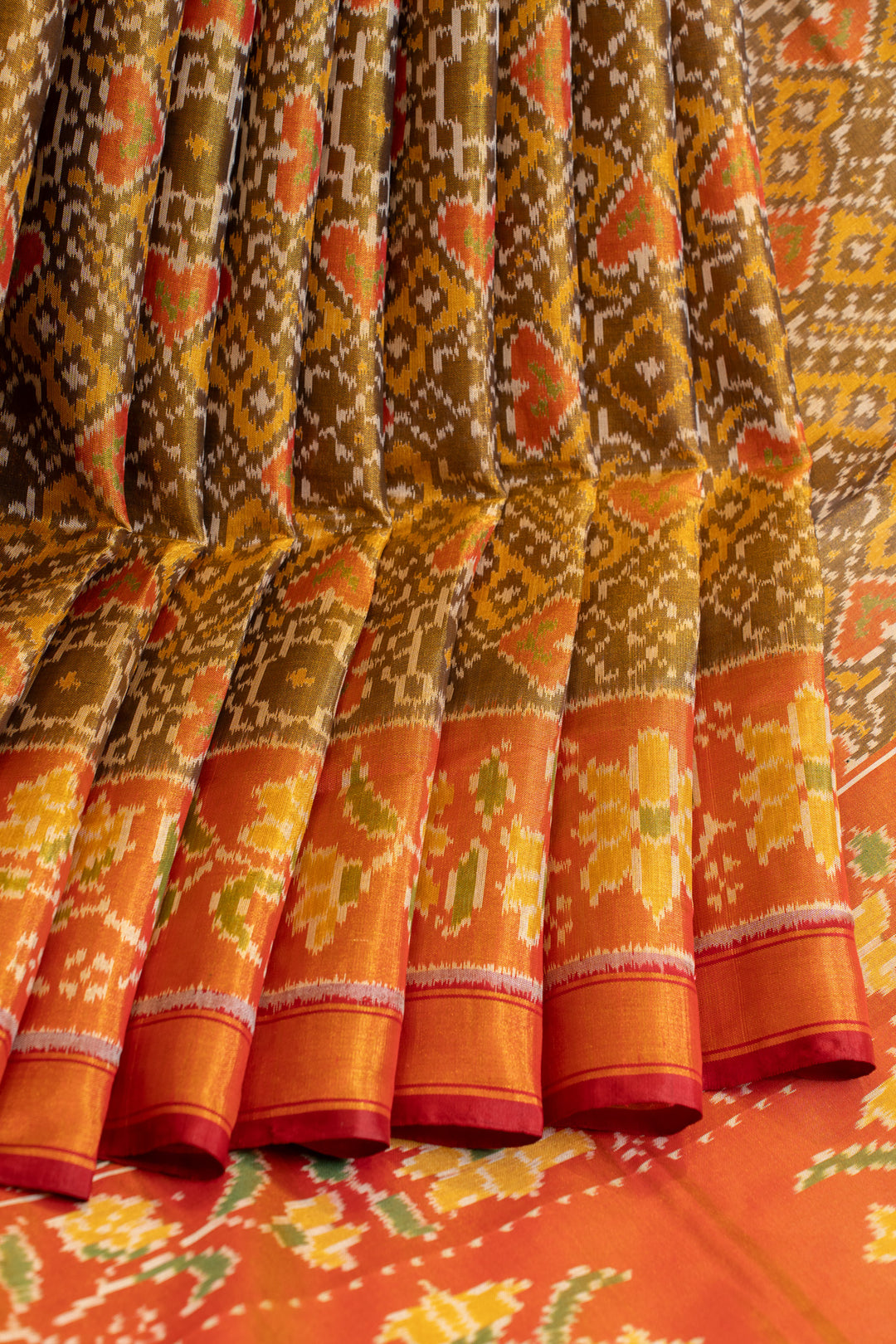 Khaki gold and orange pure patola ikat silk saree