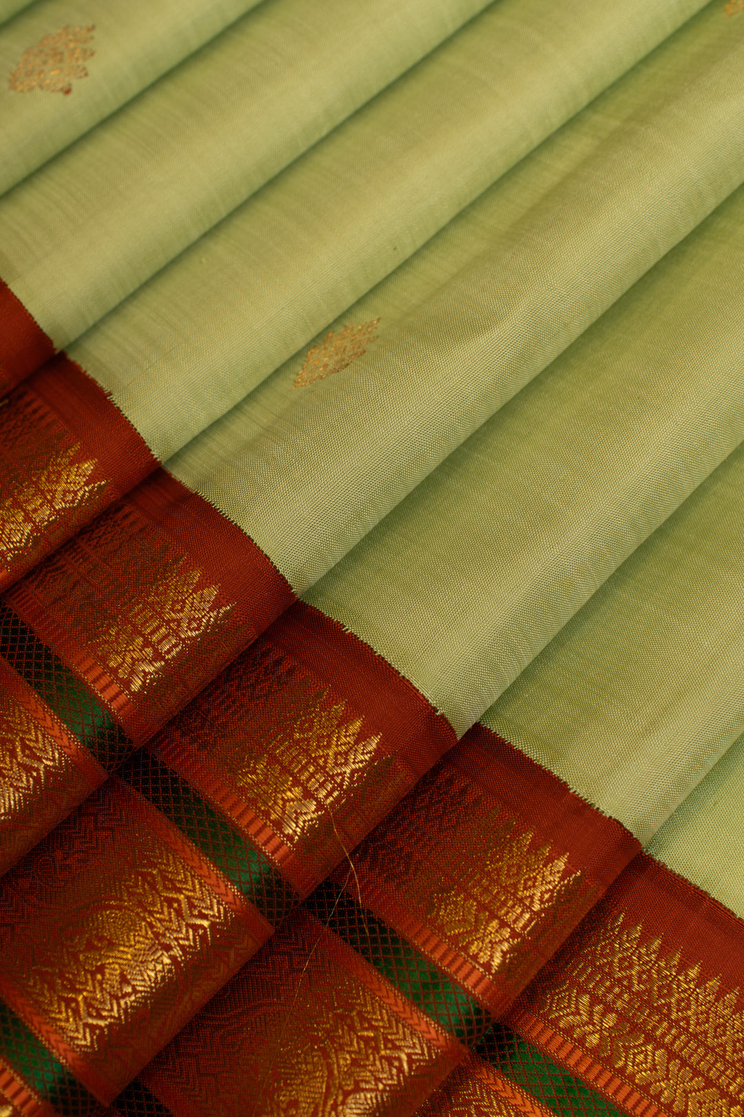 Apple green and rust orange pure Kanchipuram silk saree