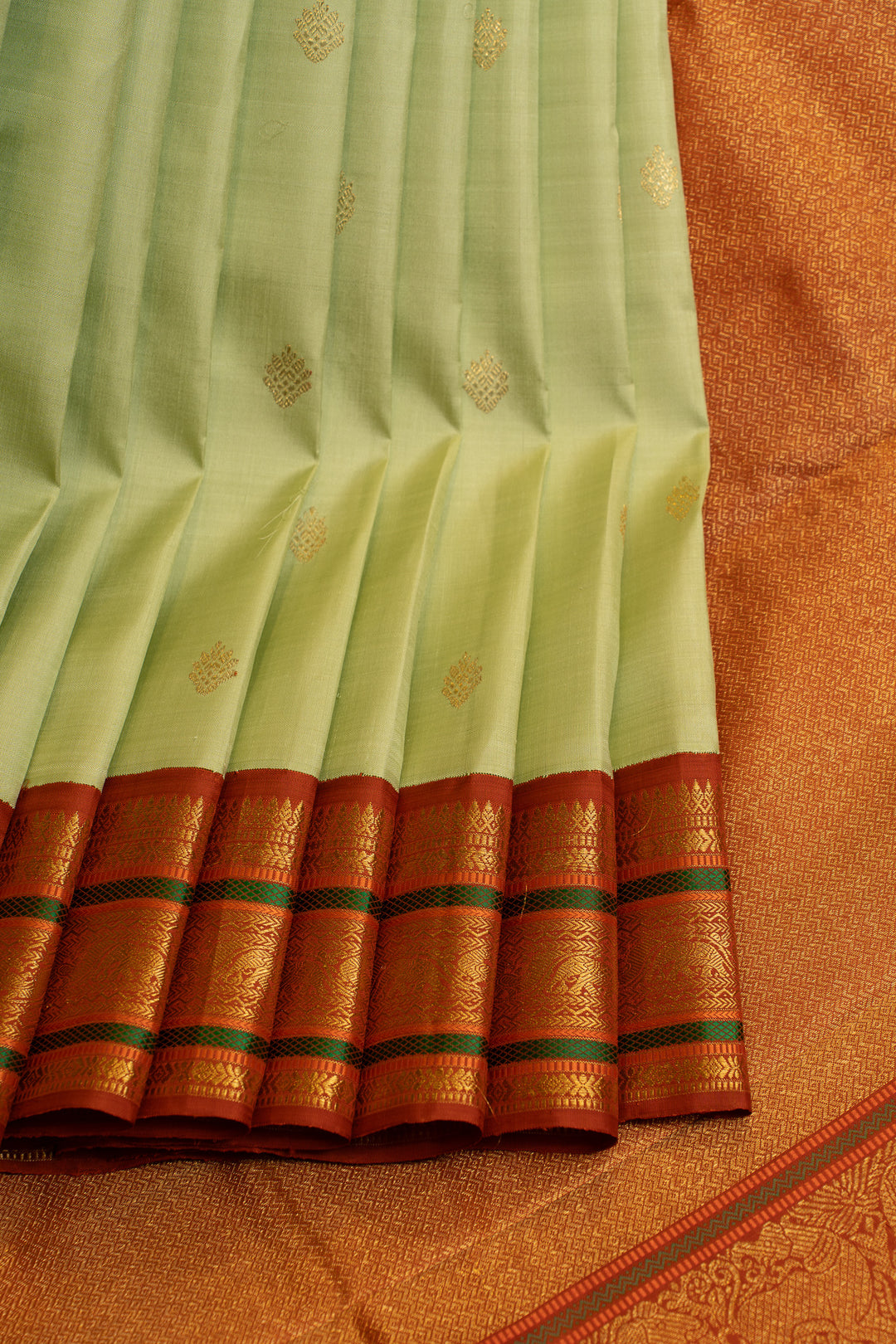 Apple green and rust orange pure Kanchipuram silk saree