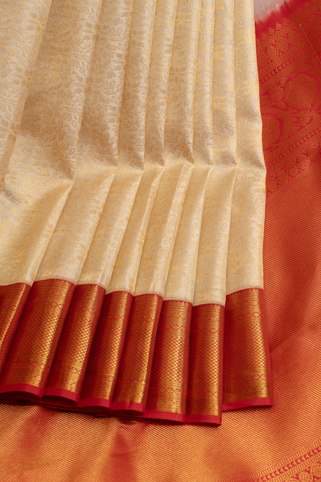 Ivory and red floral brocade pure Kanchipuram silk saree