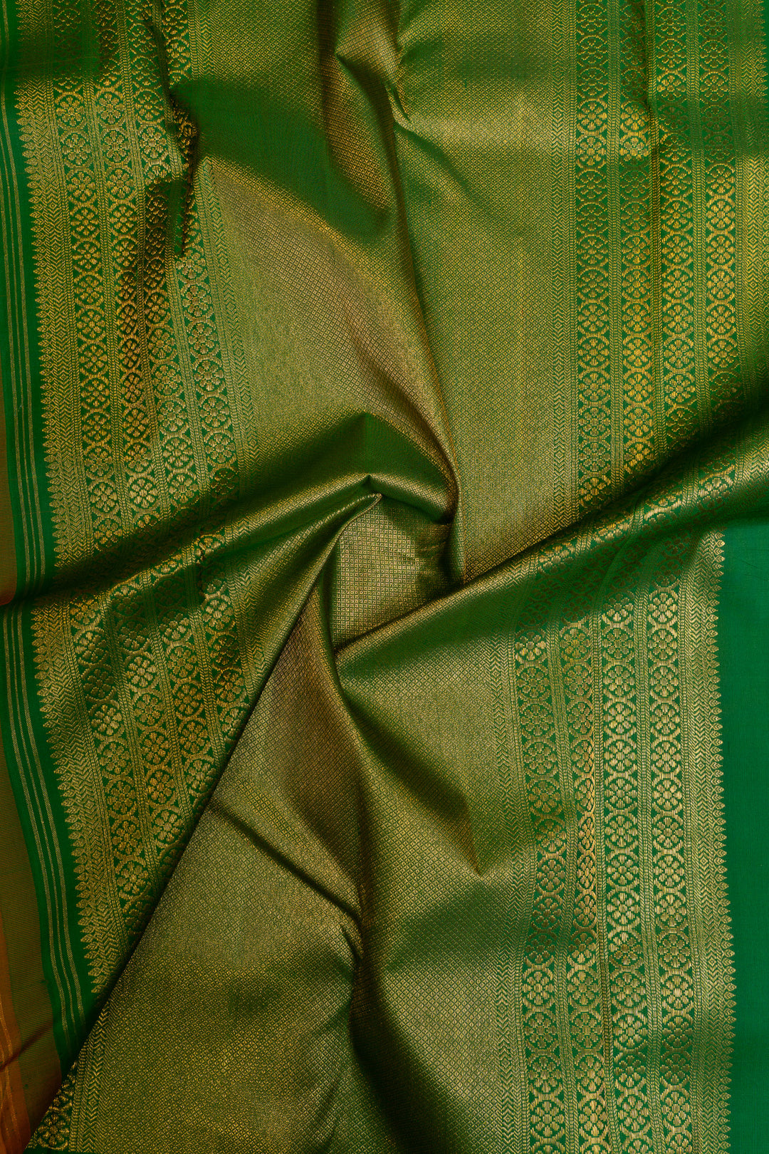 Orange and green lakshadeepam turning border pure Kanchipuram silk saree