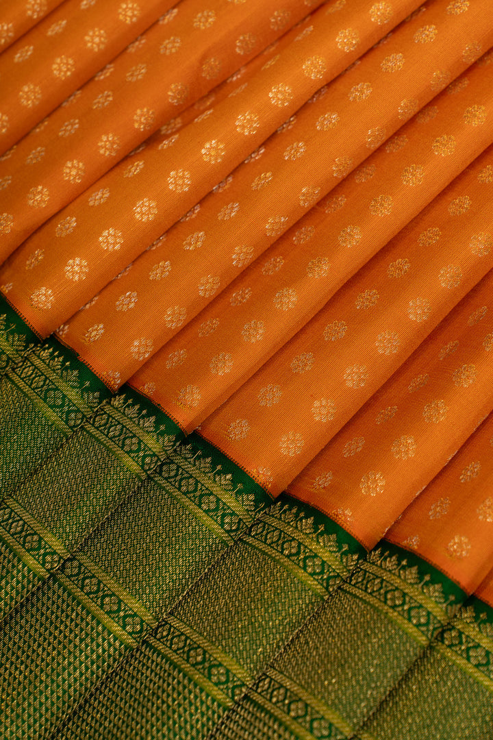 Orange and green lakshadeepam turning border pure Kanchipuram silk saree