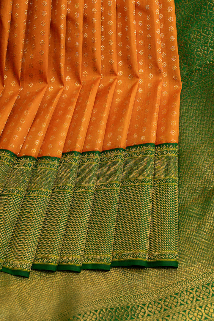 Orange and green lakshadeepam turning border pure Kanchipuram silk saree