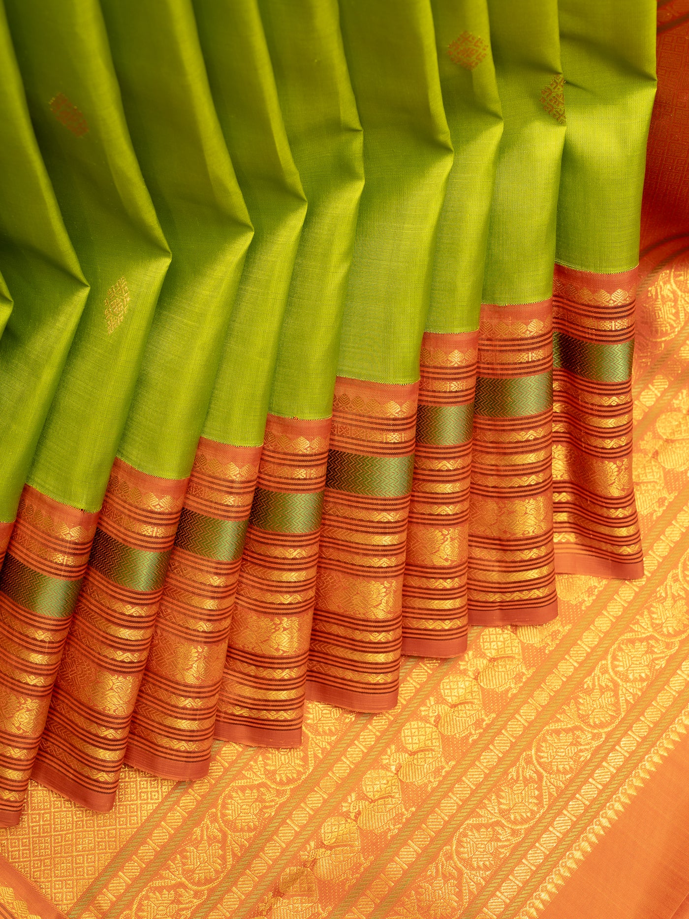 Leaf Green and Orange Korvai Varisaipettu Pure Kanjivaram Silk Saree