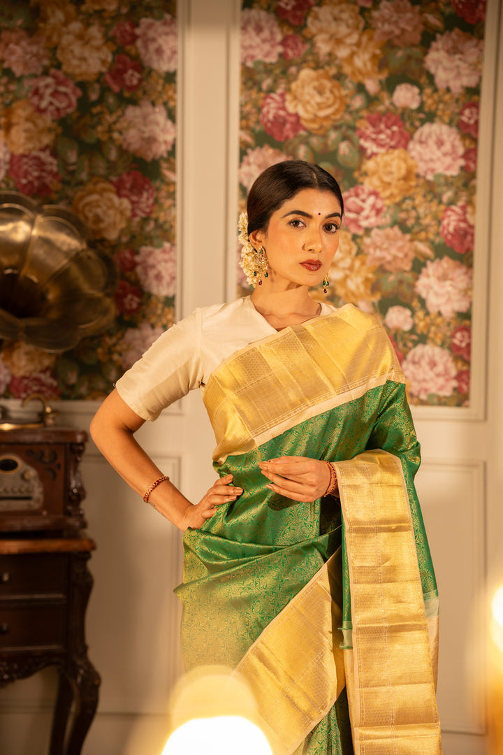 Emerald Green and Gold iruthalaipakshi brocade pure Kanchipuram silk saree