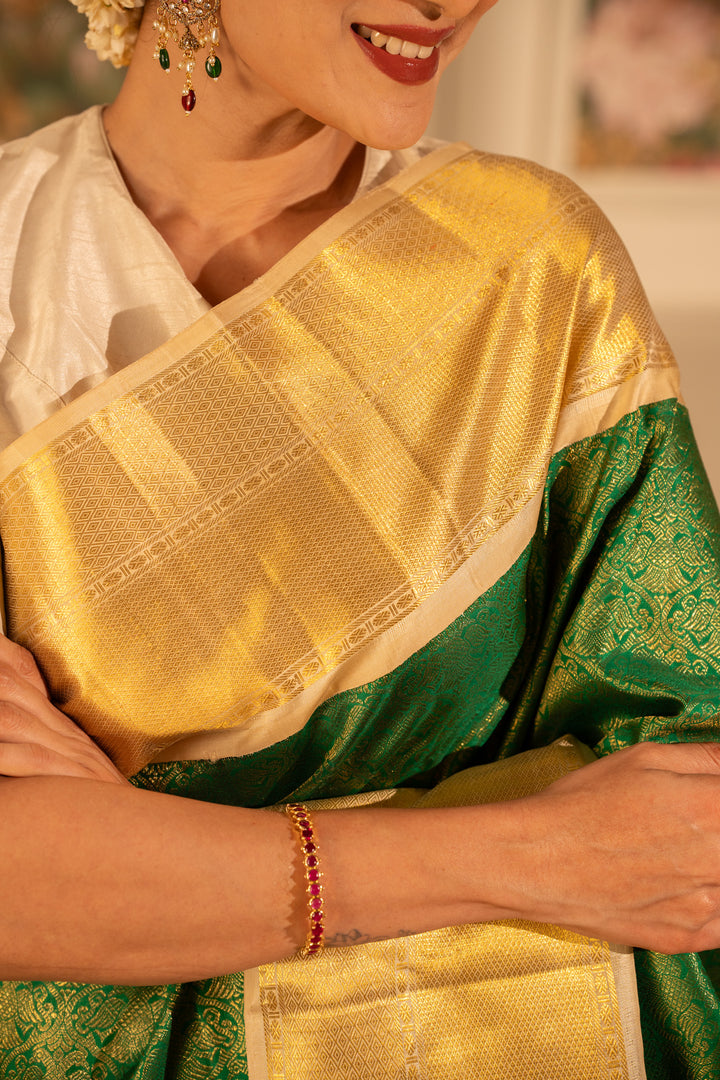 Emerald Green and Gold iruthalaipakshi brocade pure Kanchipuram silk saree