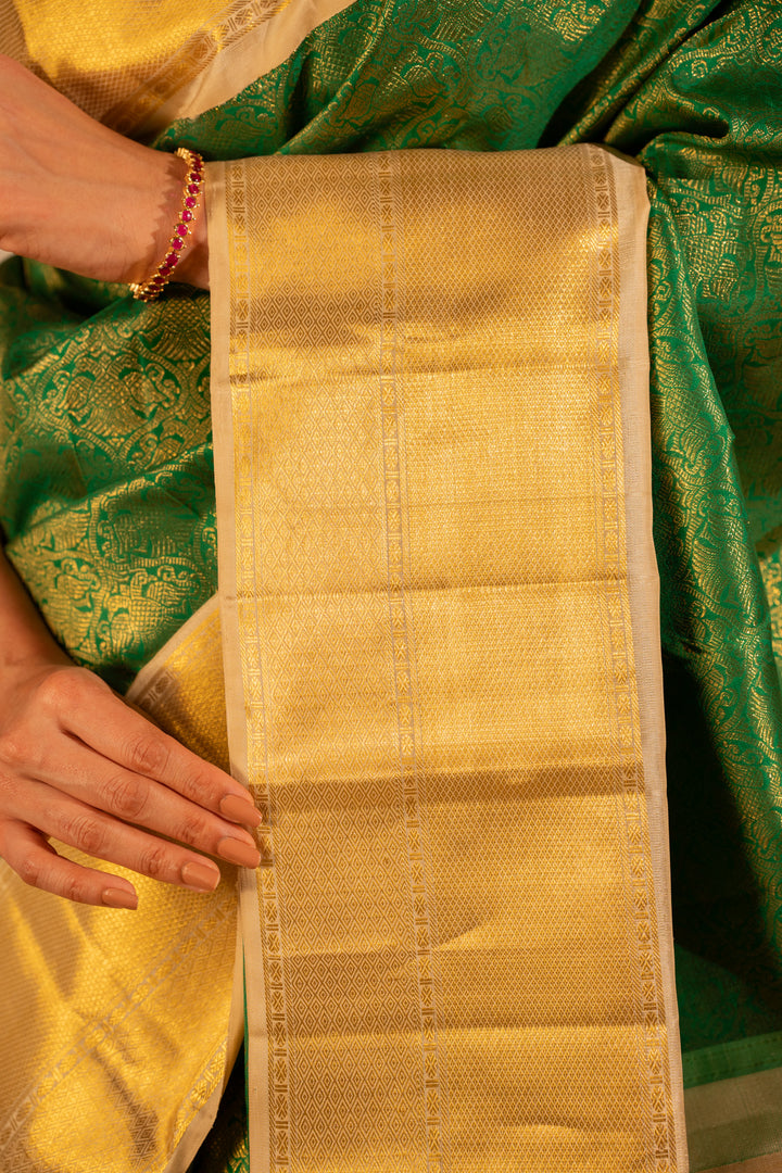 Emerald Green and Gold iruthalaipakshi brocade pure Kanchipuram silk saree