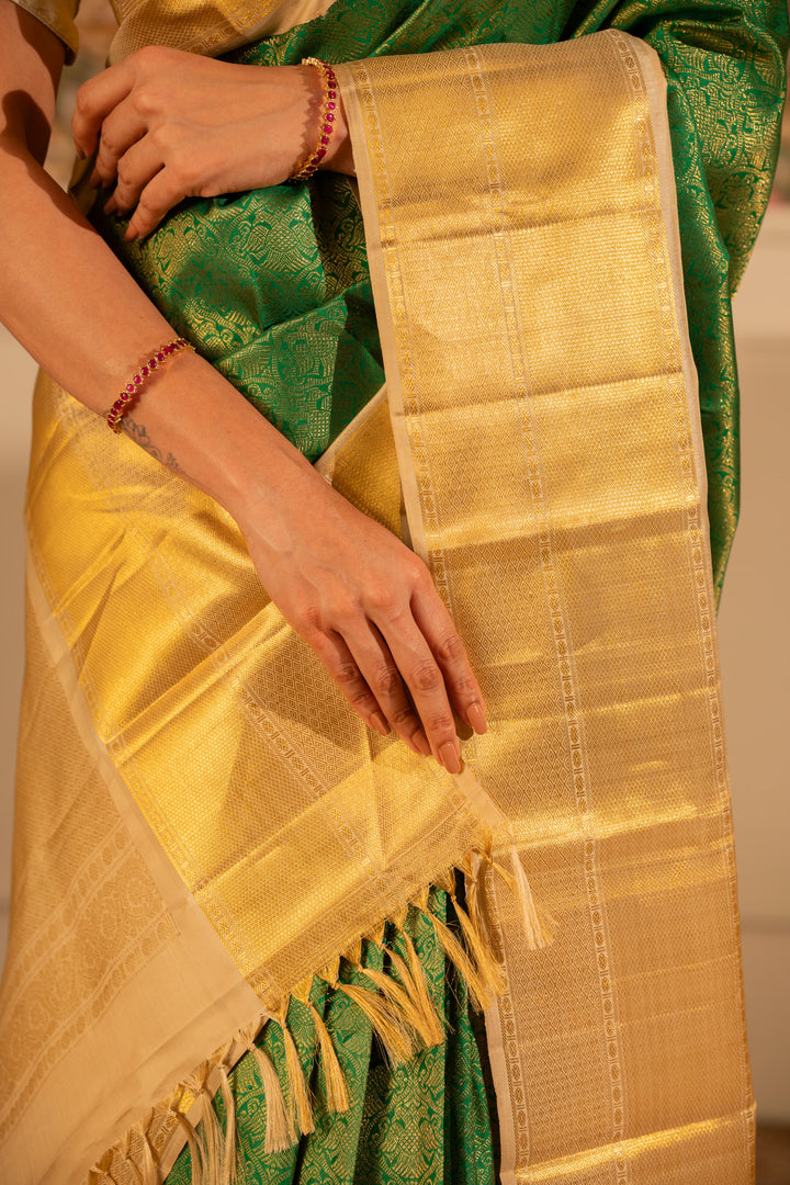 Emerald Green and Gold iruthalaipakshi brocade pure Kanchipuram silk saree