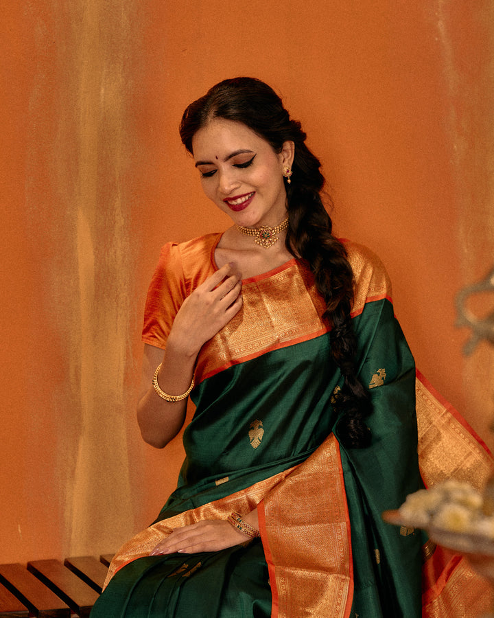 Bottle green and orange iruthalaipakshi pure Kanchipuram silk saree