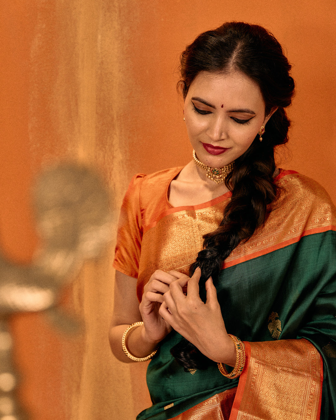 Bottle green and orange iruthalaipakshi pure Kanchipuram silk saree