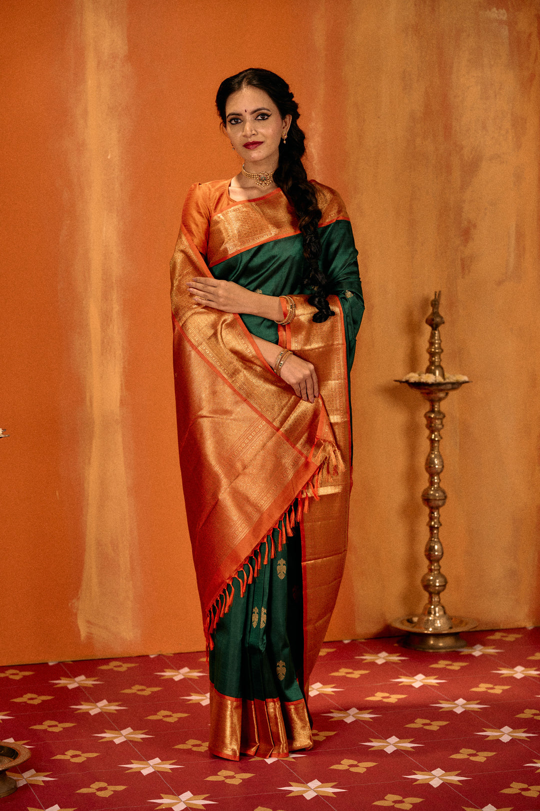 Bottle green and orange iruthalaipakshi pure Kanchipuram silk saree