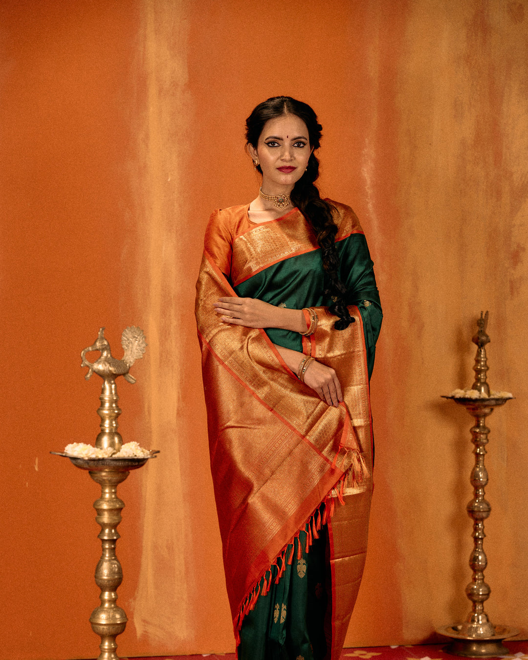 Bottle green and orange iruthalaipakshi pure Kanchipuram silk saree