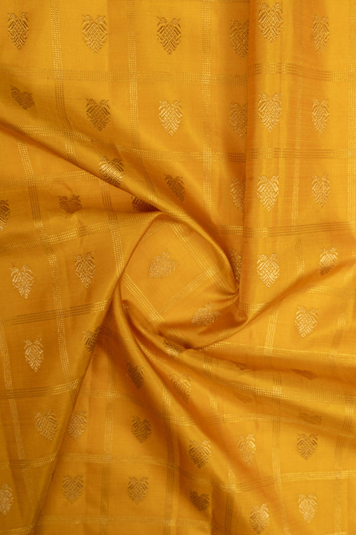 Golden yellow and green iruthalaipakshi vintage checks pure kanchipuram silk saree