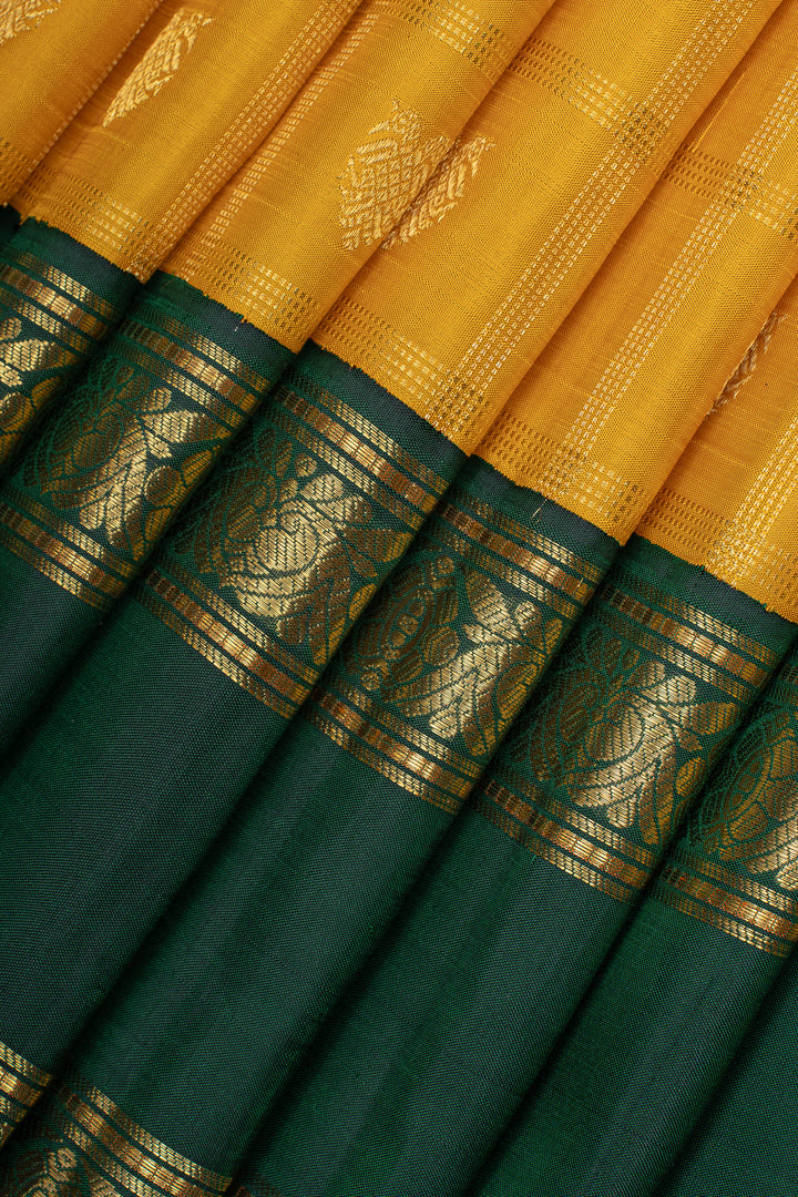Golden yellow and green iruthalaipakshi vintage checks pure kanchipuram silk saree