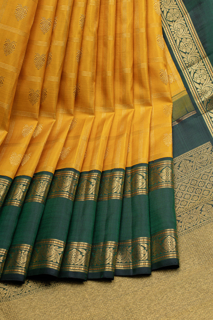 Golden yellow and green iruthalaipakshi vintage checks pure kanchipuram silk saree