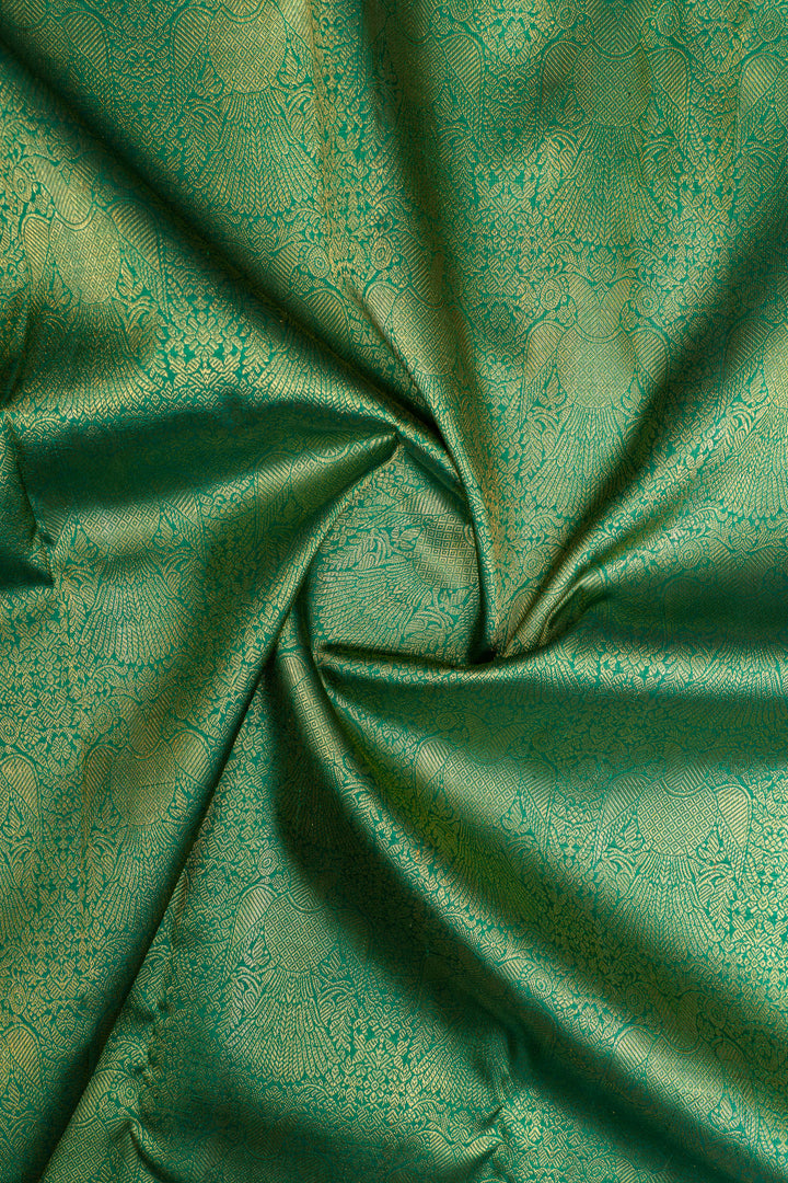 Green and ivory iruthalaipakshi brocade pure Kanchipuram silk saree