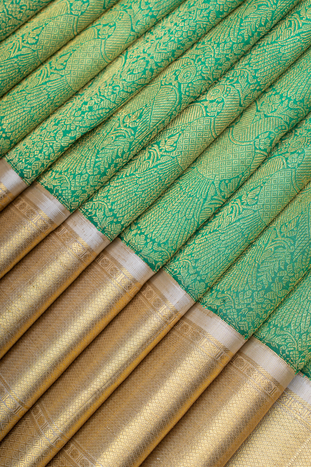 Green and ivory iruthalaipakshi brocade pure Kanchipuram silk saree