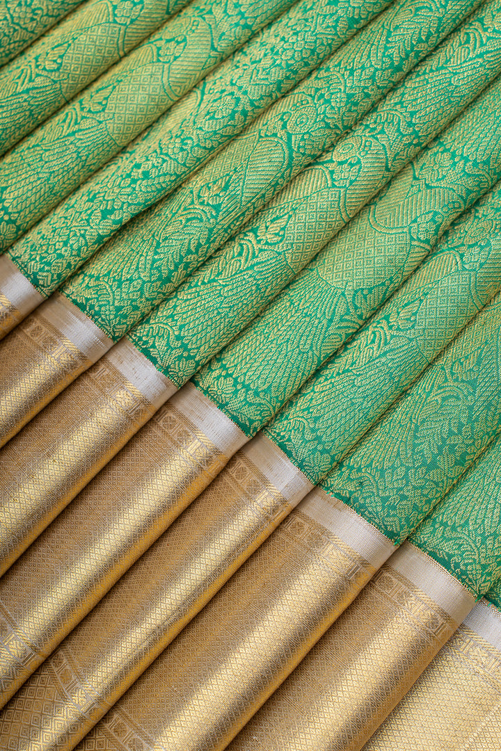 Green and ivory iruthalaipakshi brocade pure Kanchipuram silk saree