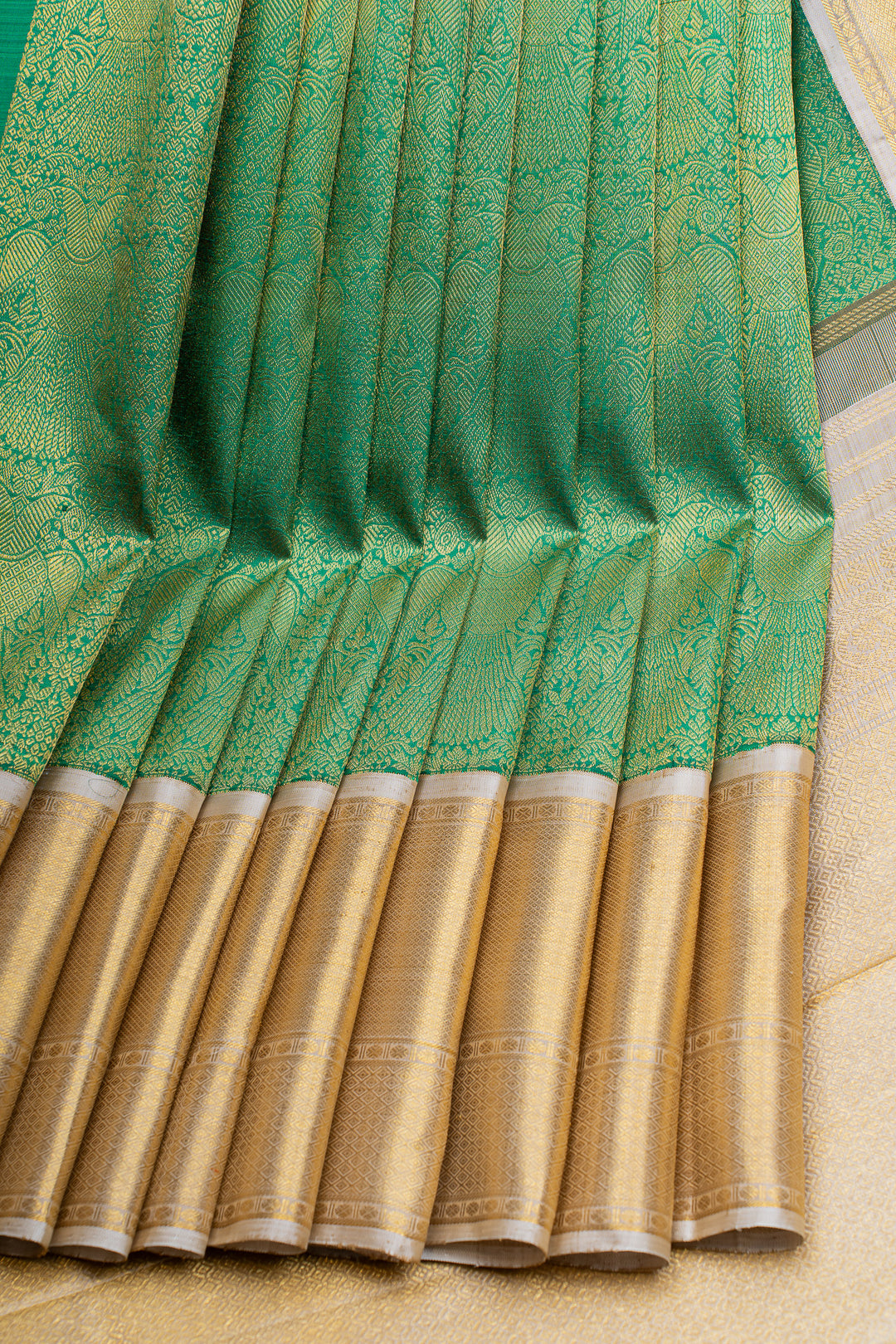 Green and ivory iruthalaipakshi brocade pure Kanchipuram silk saree