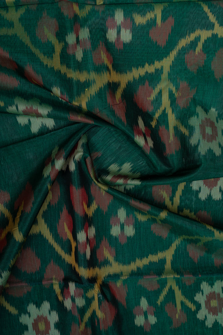 Red and green Ikat silk cotton saree