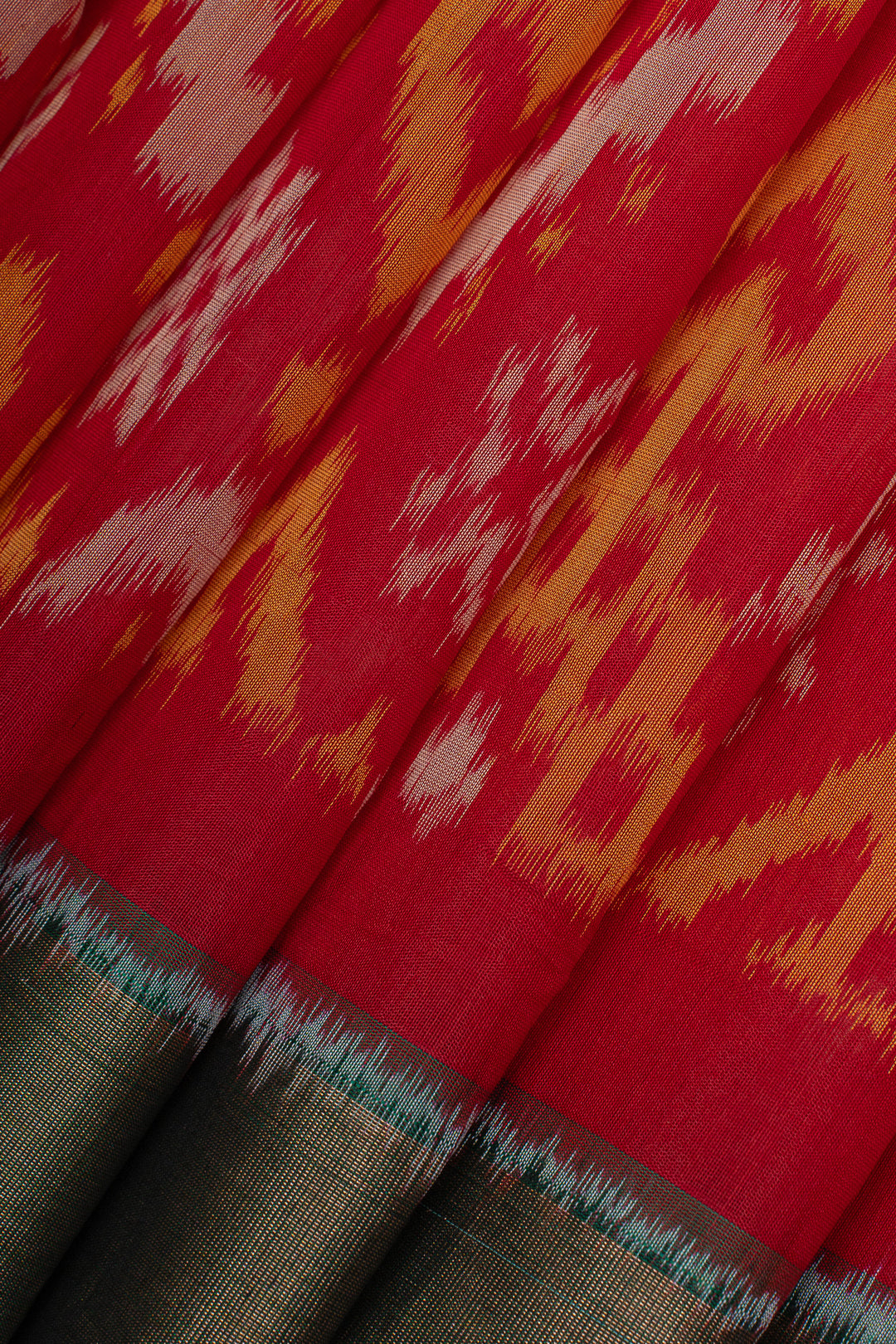 Red and green Ikat silk cotton saree