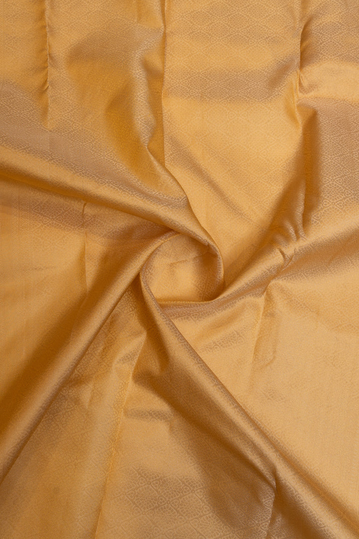 Cream and gold embossed pure Kanchipuram silk saree
