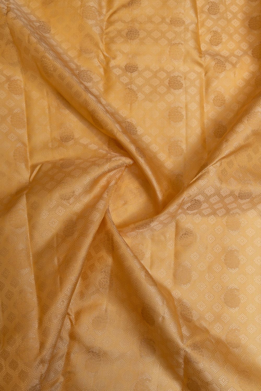 Cream and gold embossed pure Kanchipuram silk saree