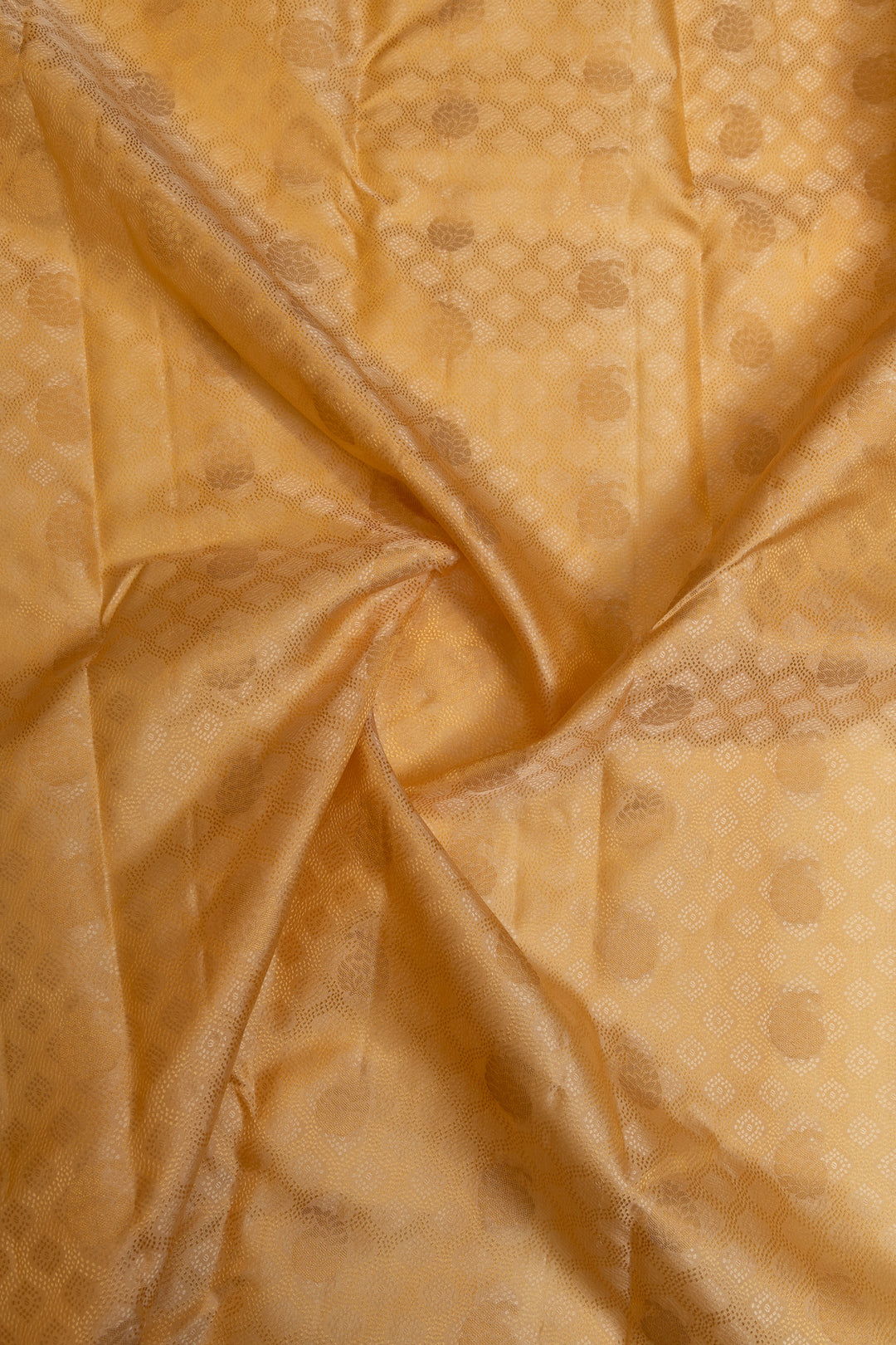 Cream and gold embossed pure Kanchipuram silk saree