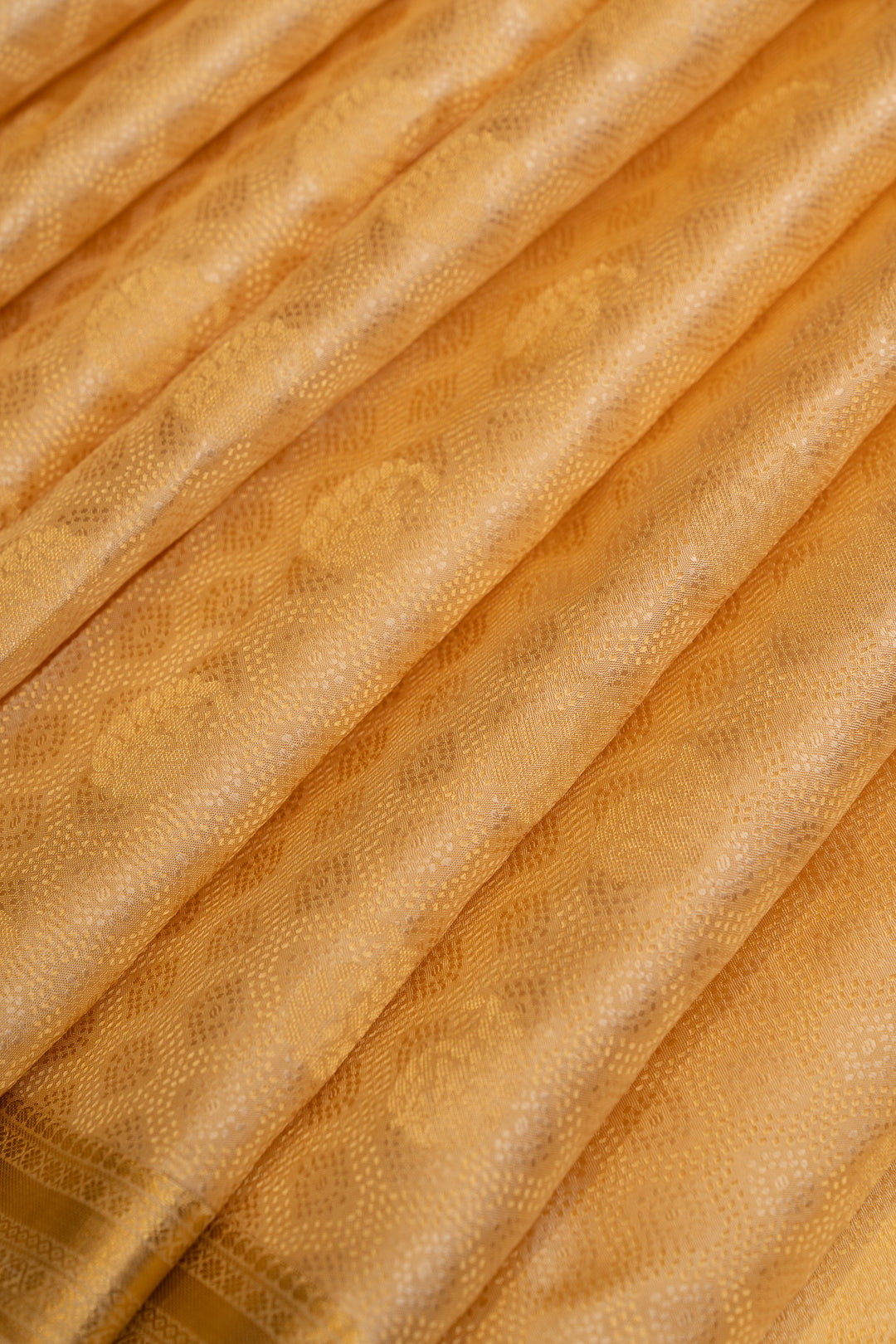 Cream and gold embossed pure Kanchipuram silk saree