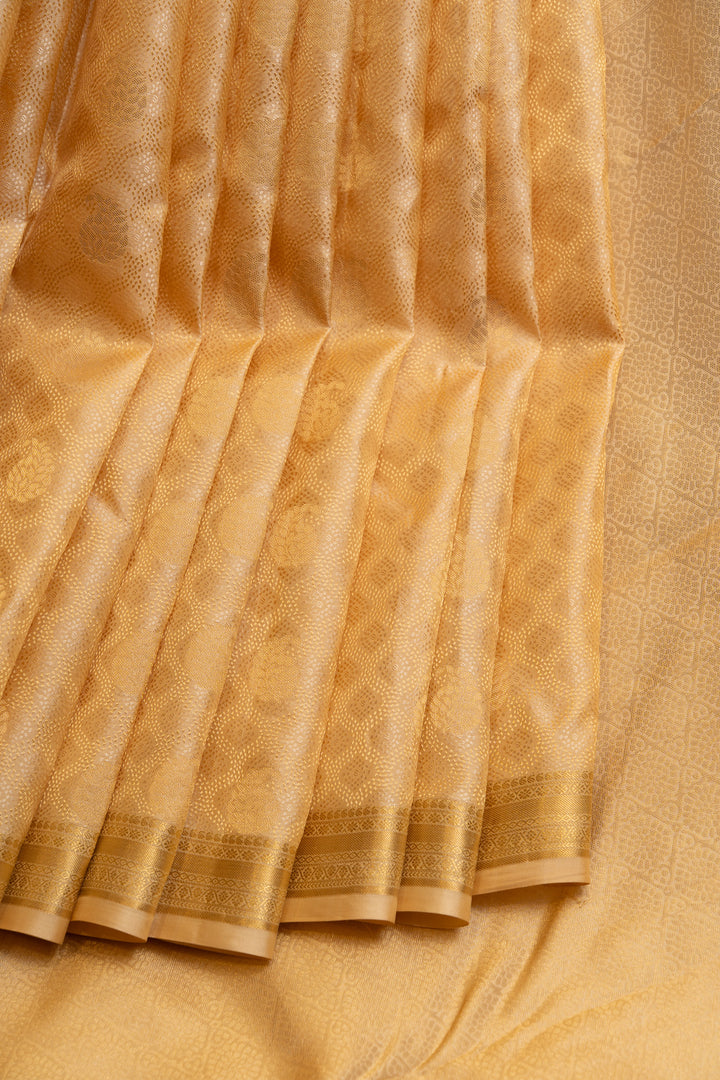 Cream and gold embossed pure Kanchipuram silk saree
