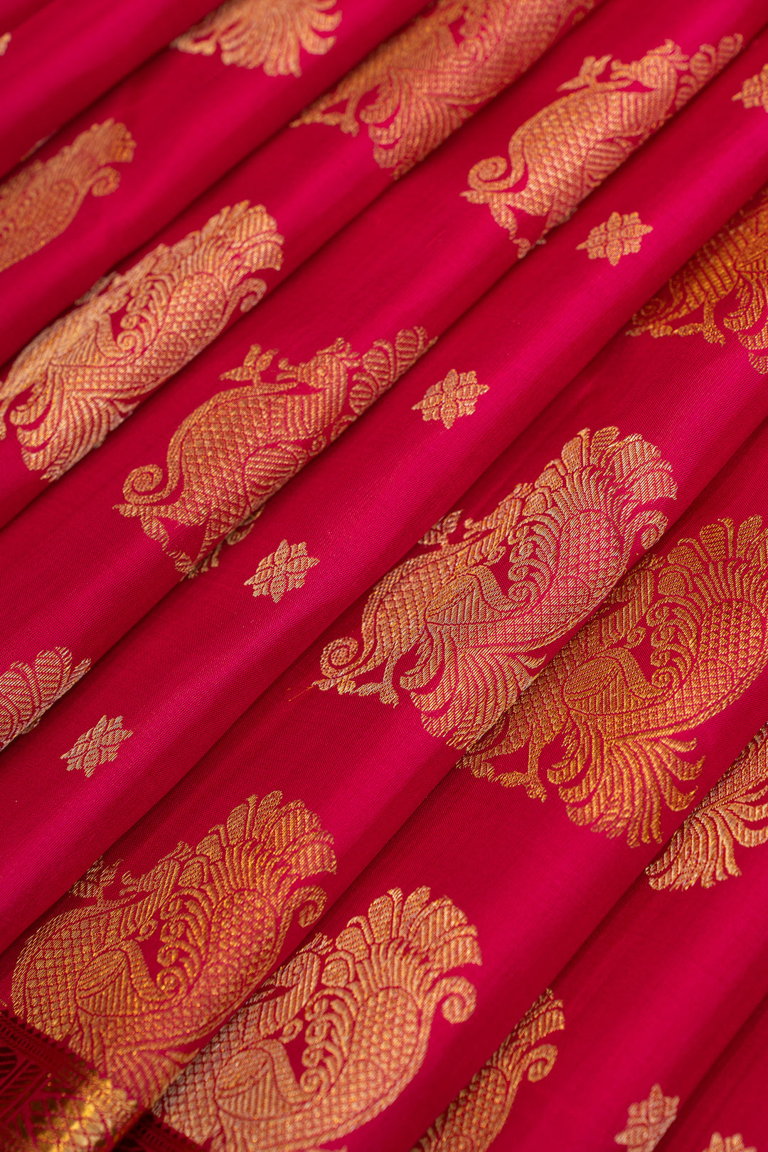 Reddish pink peacock motifs pure Kanchipuram silk saree