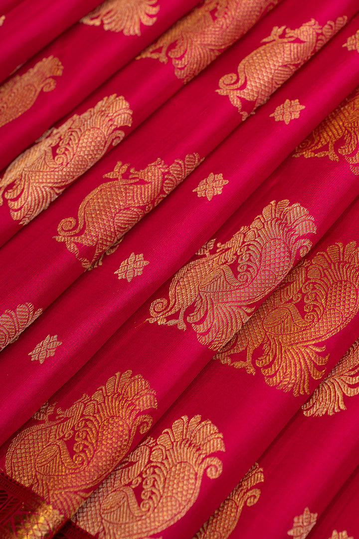 Reddish pink peacock motifs pure Kanchipuram silk saree