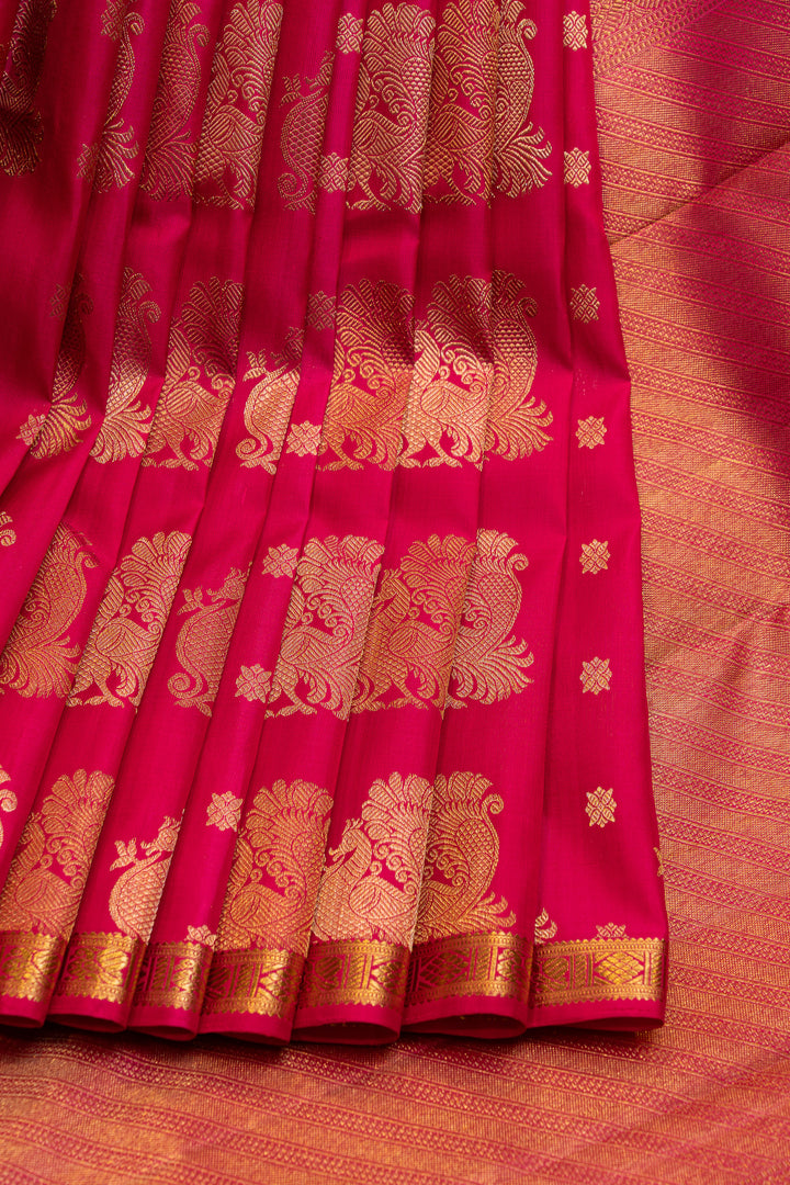 Reddish pink peacock motifs pure Kanchipuram silk saree