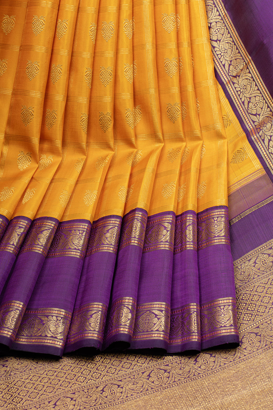 Golden yellow and purple iruthalaipakshi vintage checks pure kanchipuram silk saree