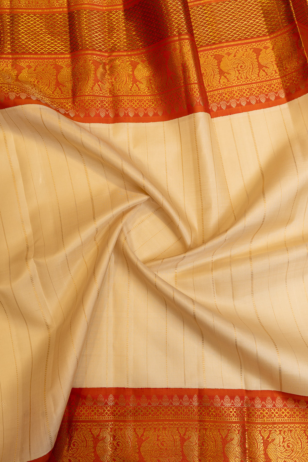 Champagne gold and rust orange grand borders pure Kanchipuram silk saree