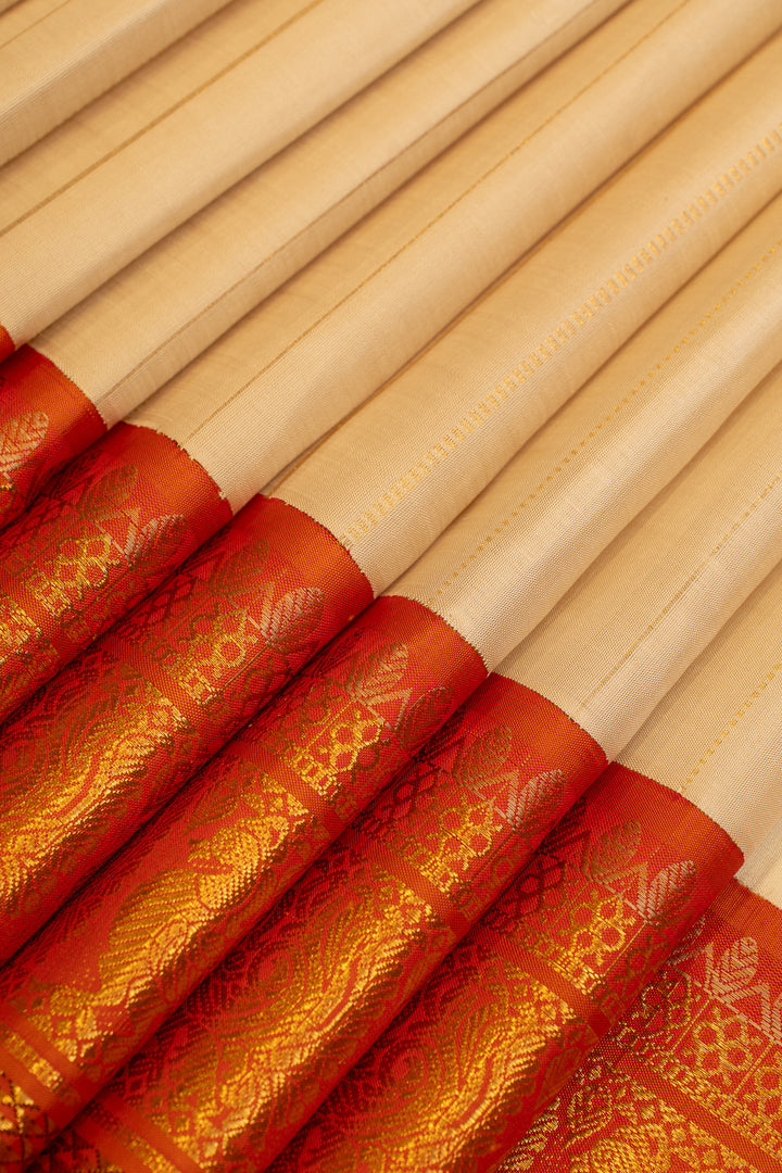 Champagne gold and rust orange grand borders pure Kanchipuram silk saree