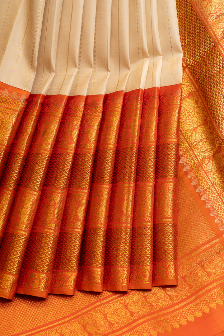 Champagne gold and rust orange grand borders pure Kanchipuram silk saree