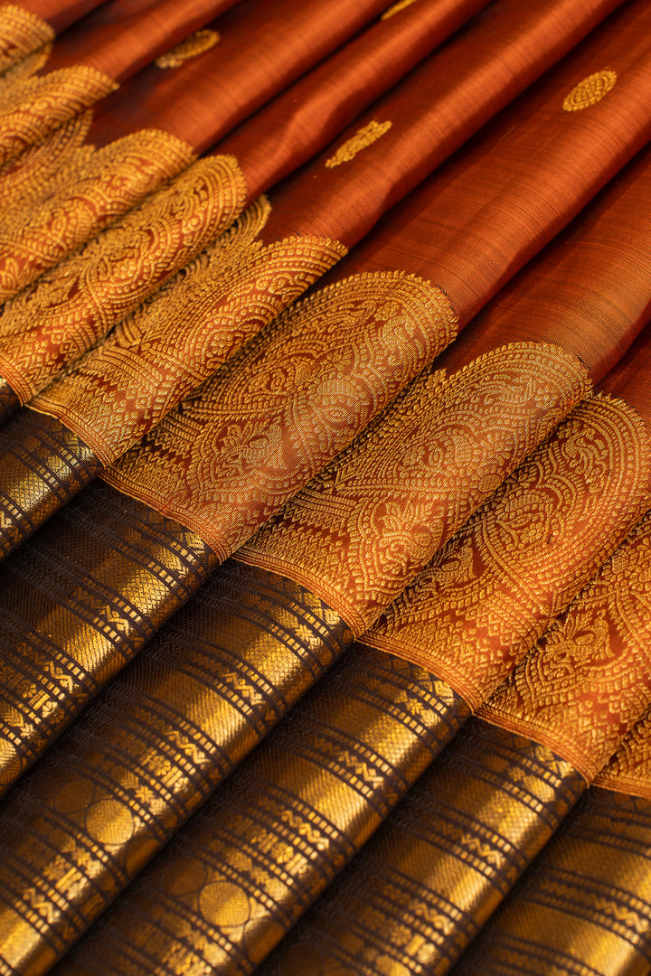 Rust orange turning border pure Kanchipuram silk saree