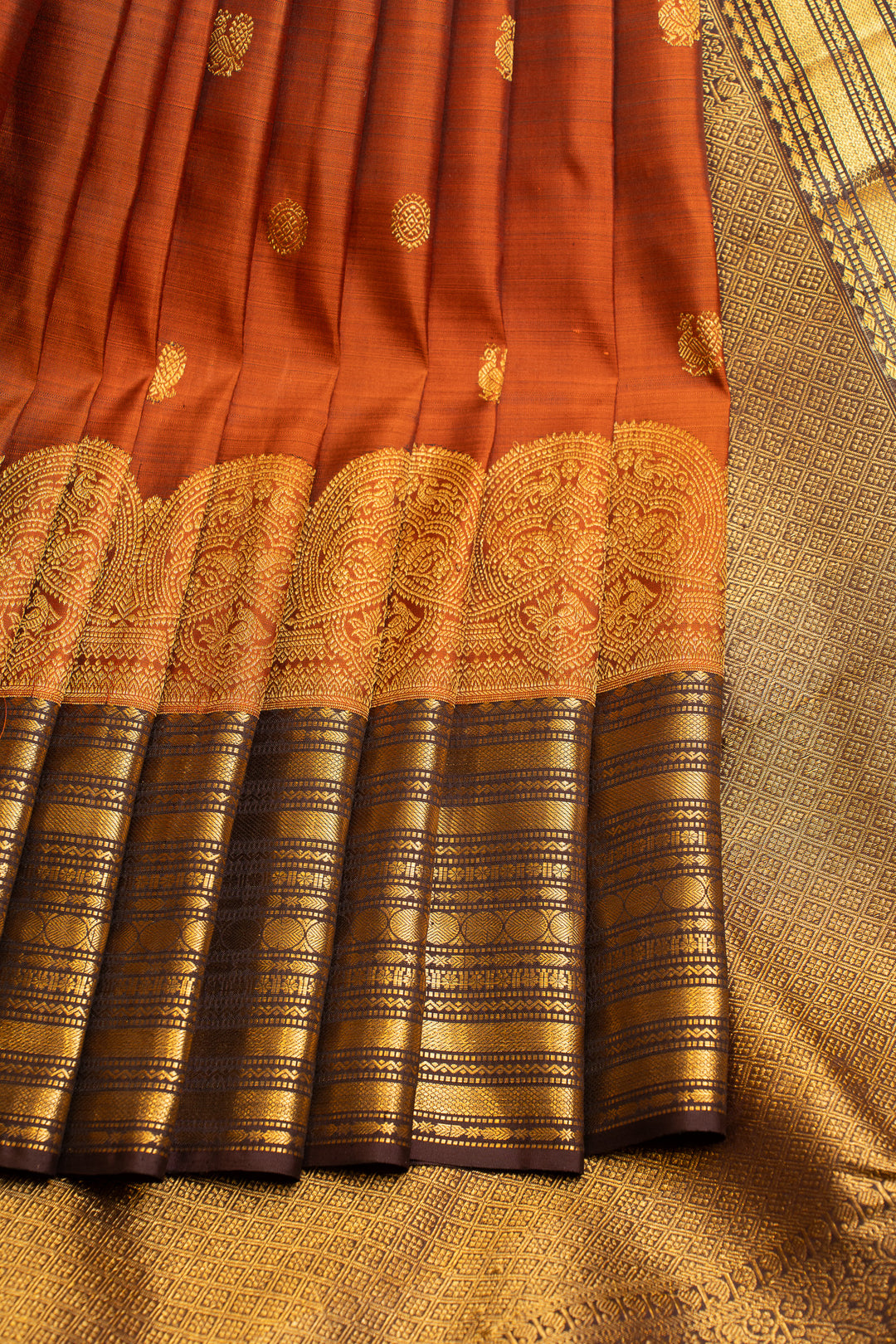 Rust orange turning border pure Kanchipuram silk saree