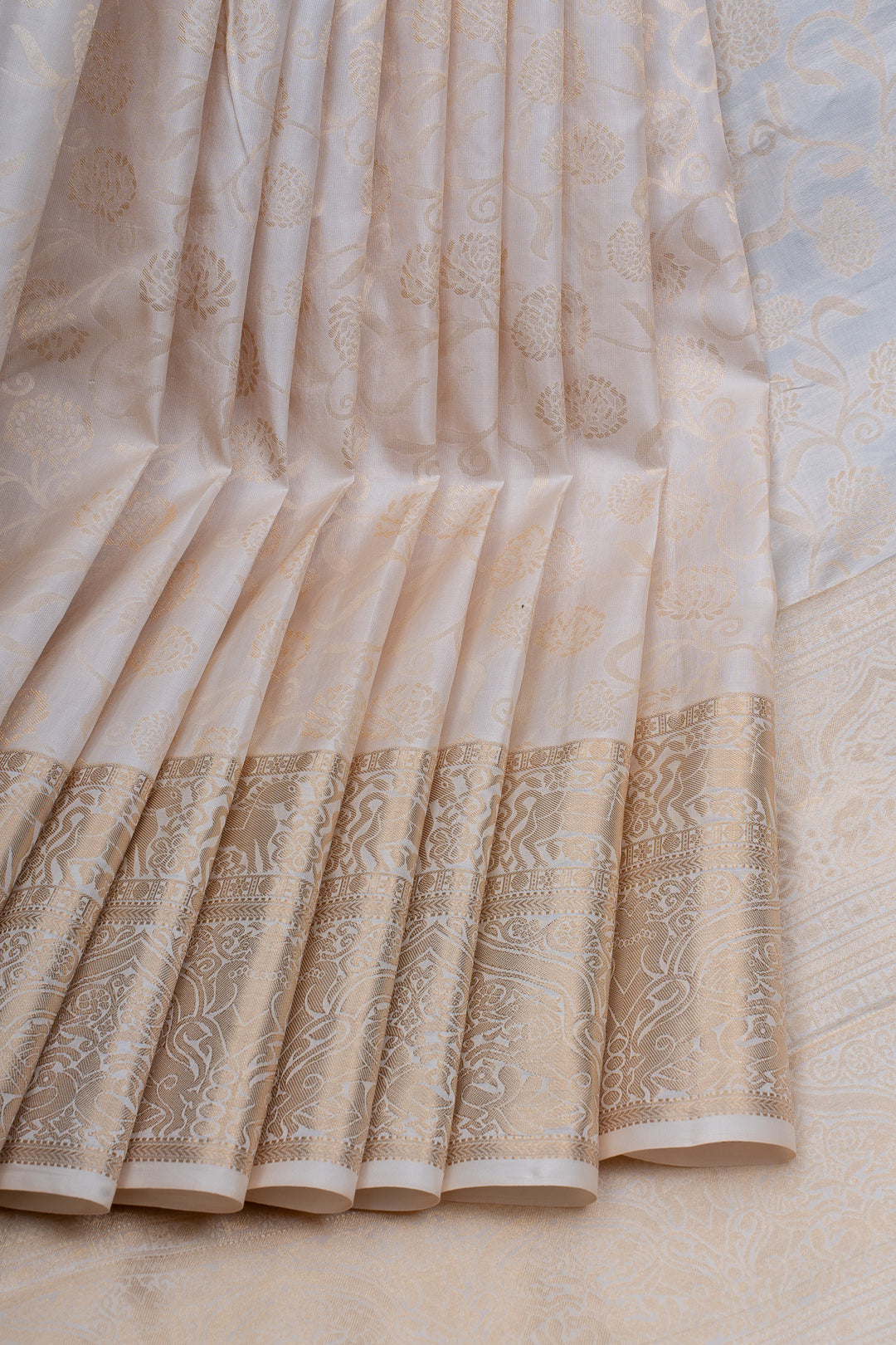 Ivory and gold floral brocade pure kanchipuram silk saree