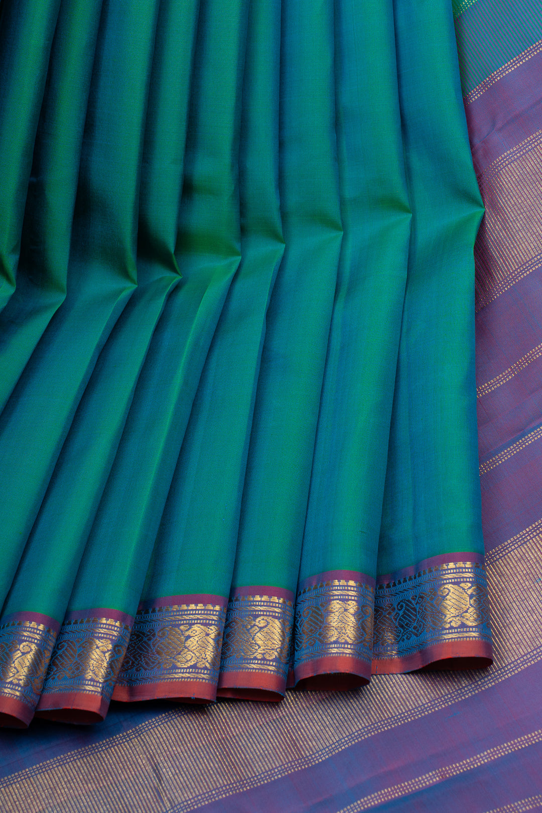 Peacock blue small border pure kanchipuram silk saree